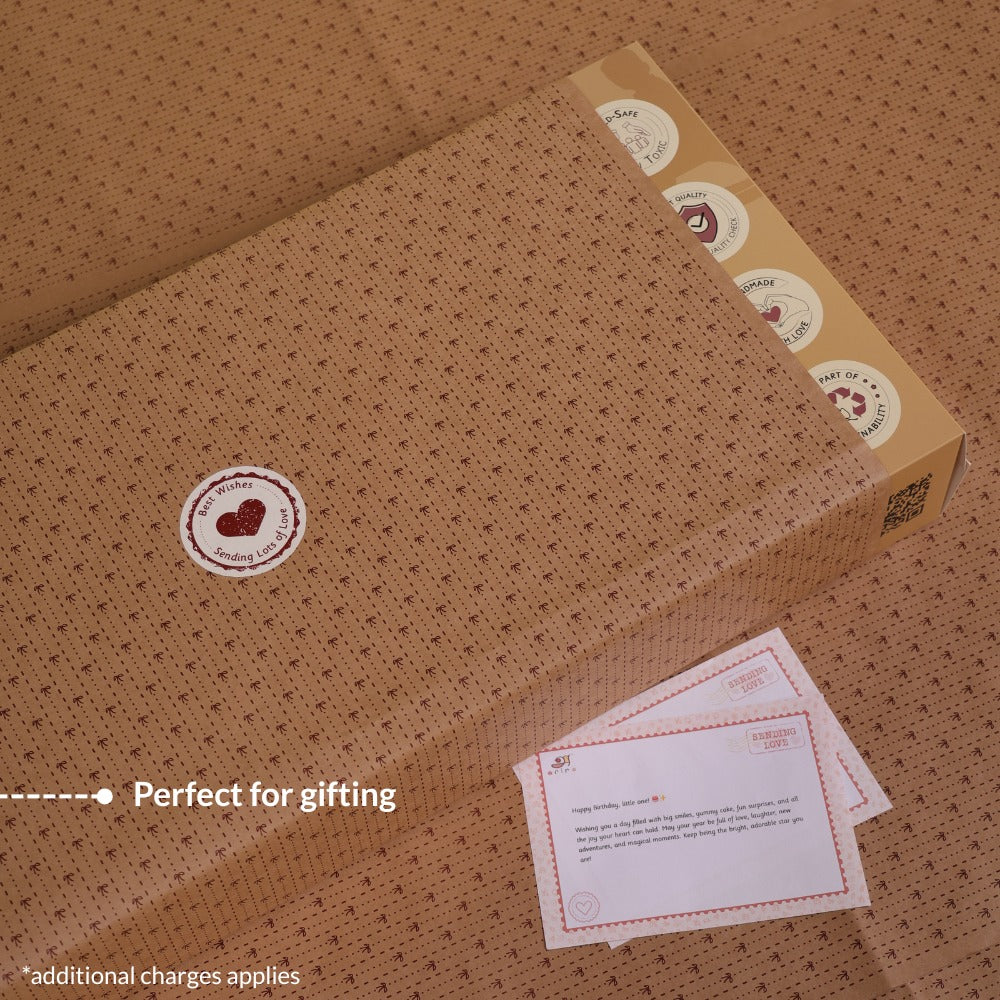 Brown gift box of Ariro Rocking Horse
with heart designs and cards on a matching brown background