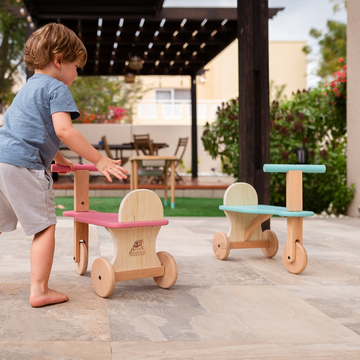 Durable, handcrafted wooden Tuk Tuks in vibrant colors, perfect for active toddlers’ playtime adventures.