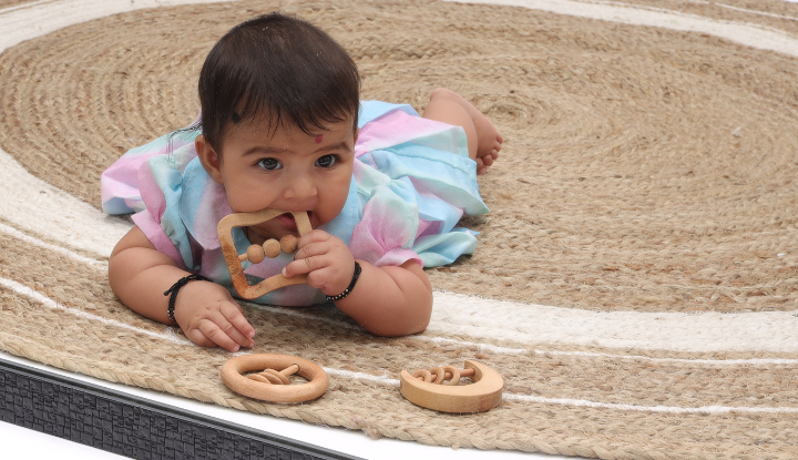 Baby playing with the rattle 