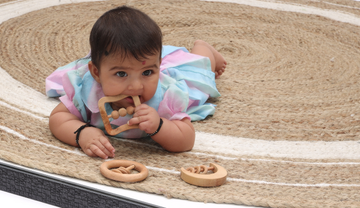Baby playing with the rattle 