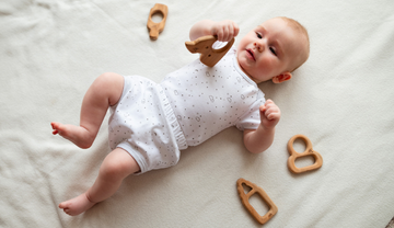 Child Holding a teether 