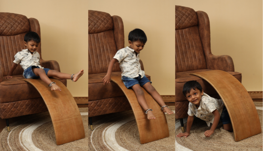 Child using Ariro Wobble Board as slide, tunnel and creative play surface