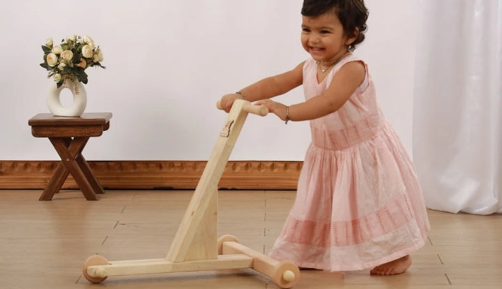 Toddler Walking With Help of Wooden walker 
