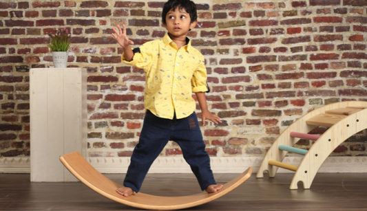 Kid Playing With The Balancing Board 