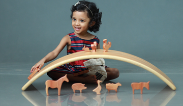 Child Playing With Balancing Board 