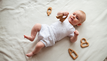 Baby Playing With the Wooden Teether
