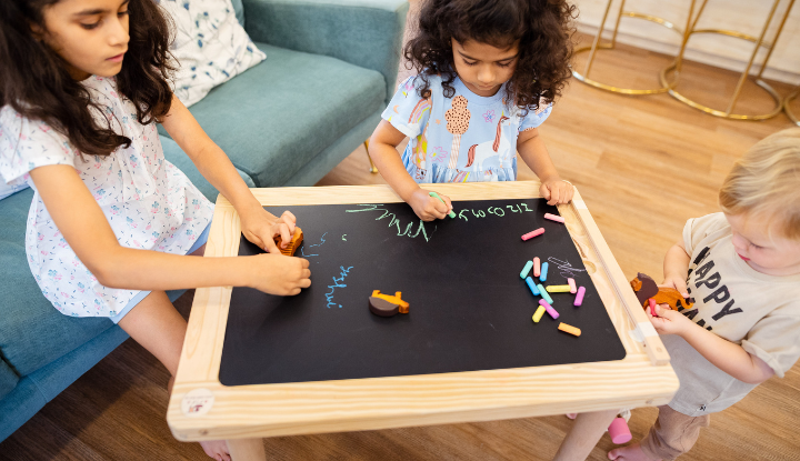 Children Engaging themselves with Wooden Sensory Table 
