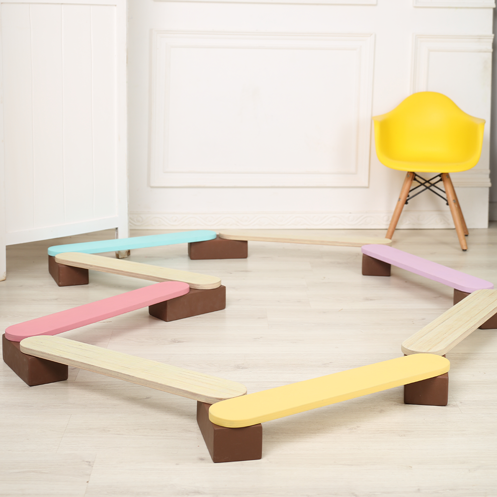 Ariro Montessori balancing beam for kids arranged in a circular shape supporting proprioception, coordination and balance development for children.