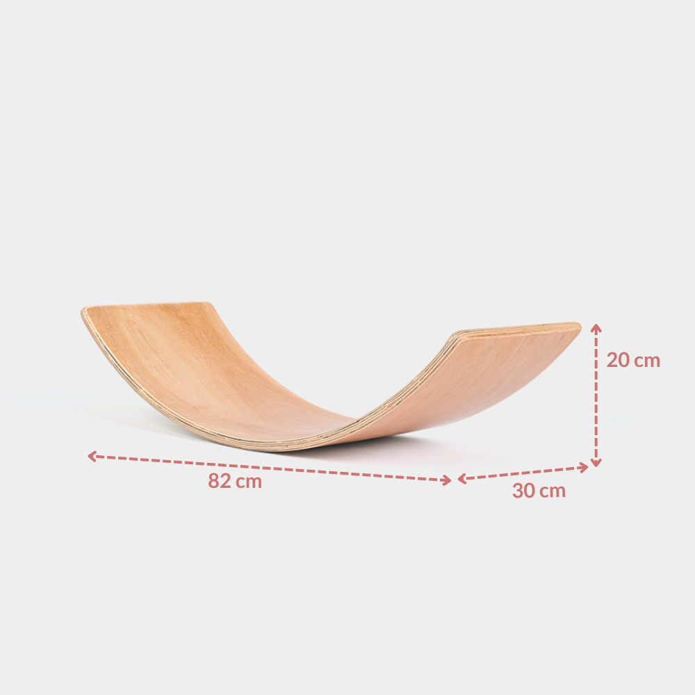 Wooden balance board with measurements on a white background