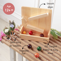 Classic ball slider  is made from FSC-certified rubber & ivory wood, features smooth edges, vegetable-dyed balls, and is ideally sized for toddlers’ hands.
