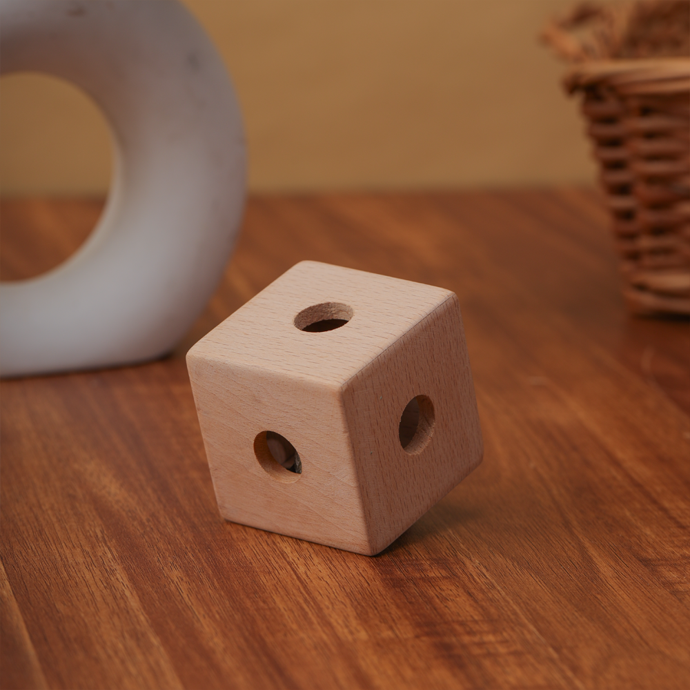Cube Rattle , designed to engage toddlers with soothing sounds and tactile play.





