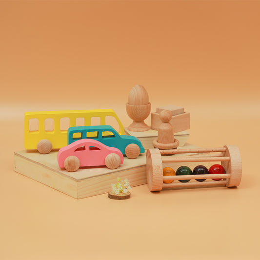 A colorful Montessori kit featuring wooden vehicles, rattles  and sensory toys for children above 6 months 