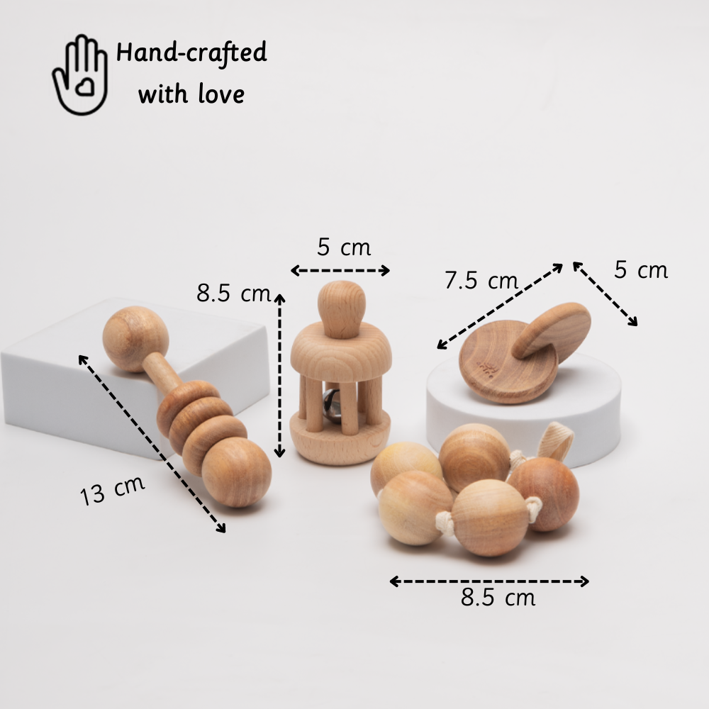 hand-crafted wooden toys including bell rattle, interlocking discs, and grasping beads – designed for babies aged 3+ months with safe sizing for small hands 