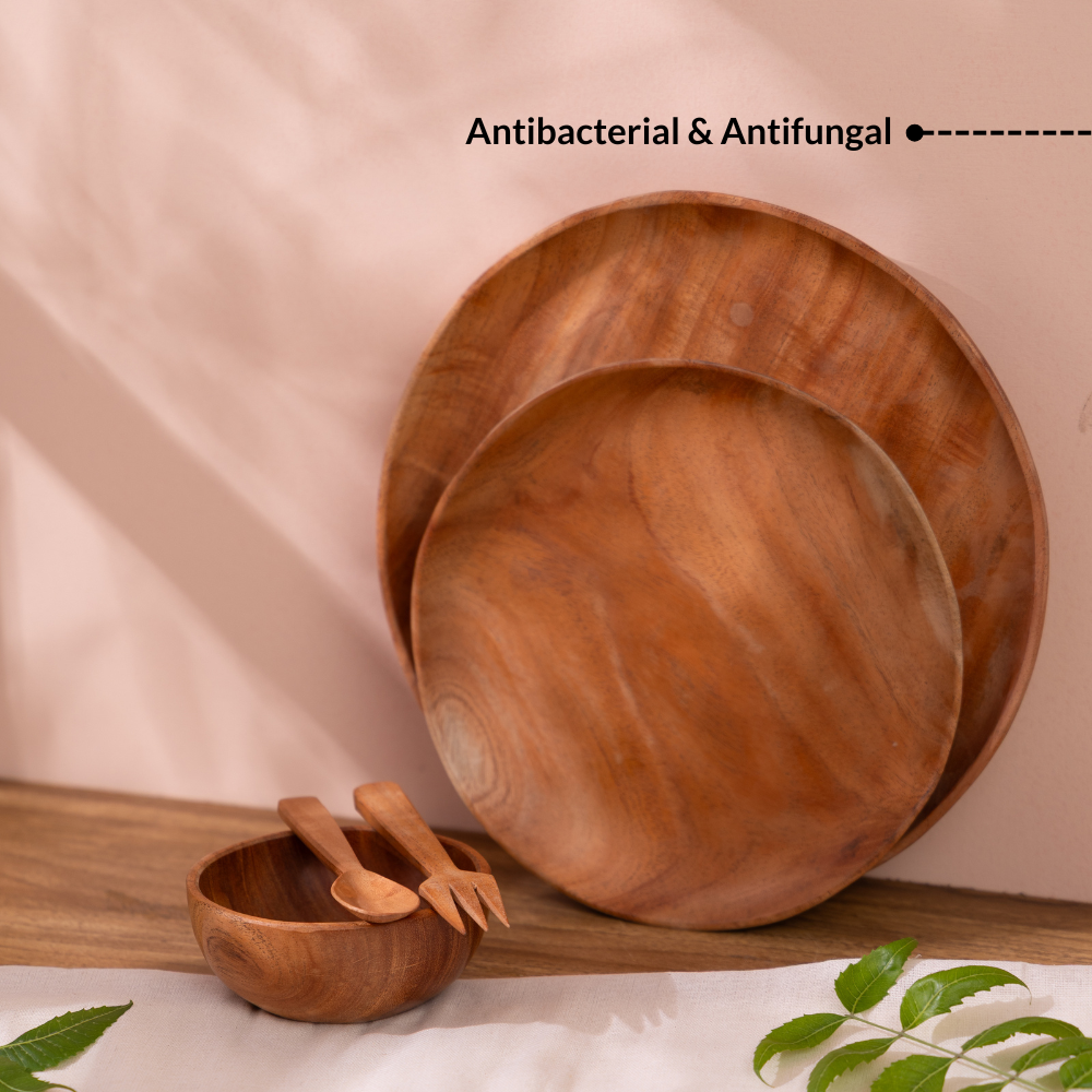 Neem wood baby dinner plates and bowl showing antibacterial and antifungal properties of natural neem wood.