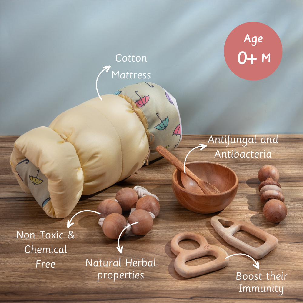 Montessori newborn kit with herbal wooden teethers, non-toxic rattles, a cotton mattress, and a neem bowl set for immunity and hygiene.