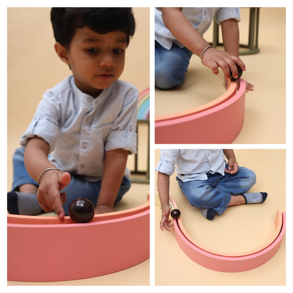 Rainbow stacker- Big designed for kids to play creatively by rolling the ball over the arches, enhancing motor skills and imaginative play.




