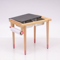 Engage kids in hands-on learning and creative play with this versatile sensory table featuring dual stainless steel bins, a sliding black cover, and a convenient paper roll holder.