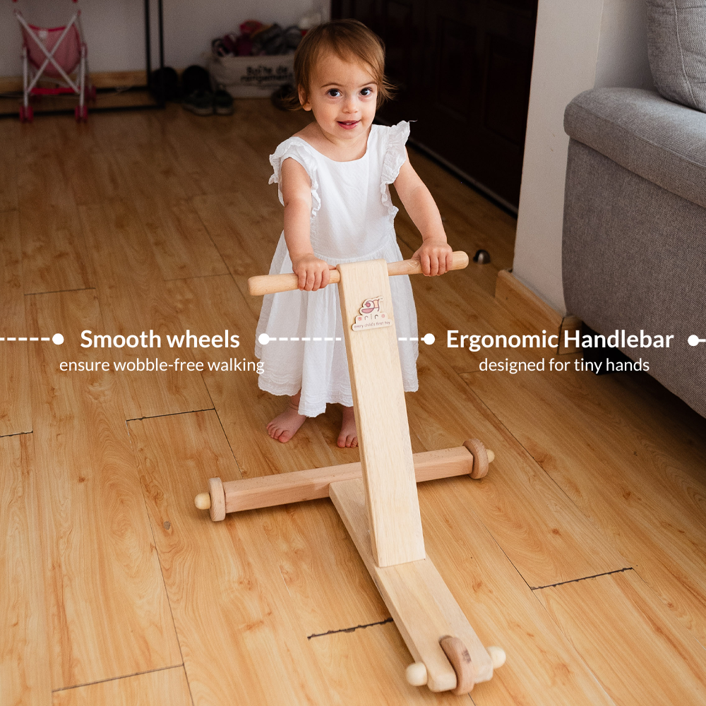Traditional push being used by a child and highlighting ergonomic design of wheels and handlebar