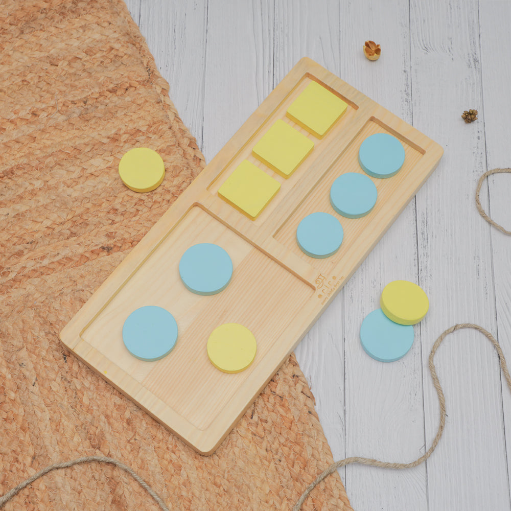 Tray Sorter with yellow squares and blue circles for shape and color matching activities.




