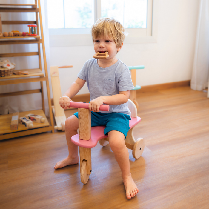 Handcrafted wooden Tuk Tuk designed for toddlers, offering smooth rides, perfect balance, and playful comfort.