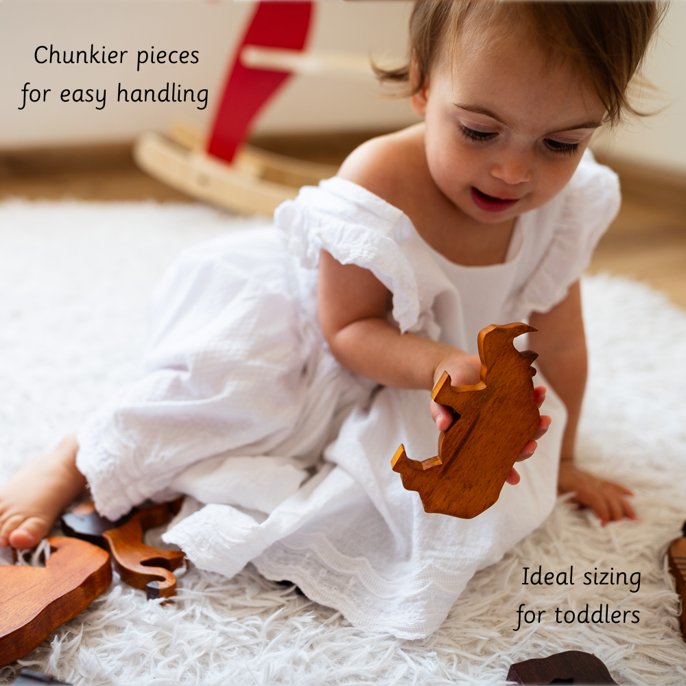 Wooden Wild Animals ( Set of 12)  showing a toddler playing comfortably with chunky, easy-to-hold pieces that are ideally sized for little hands.