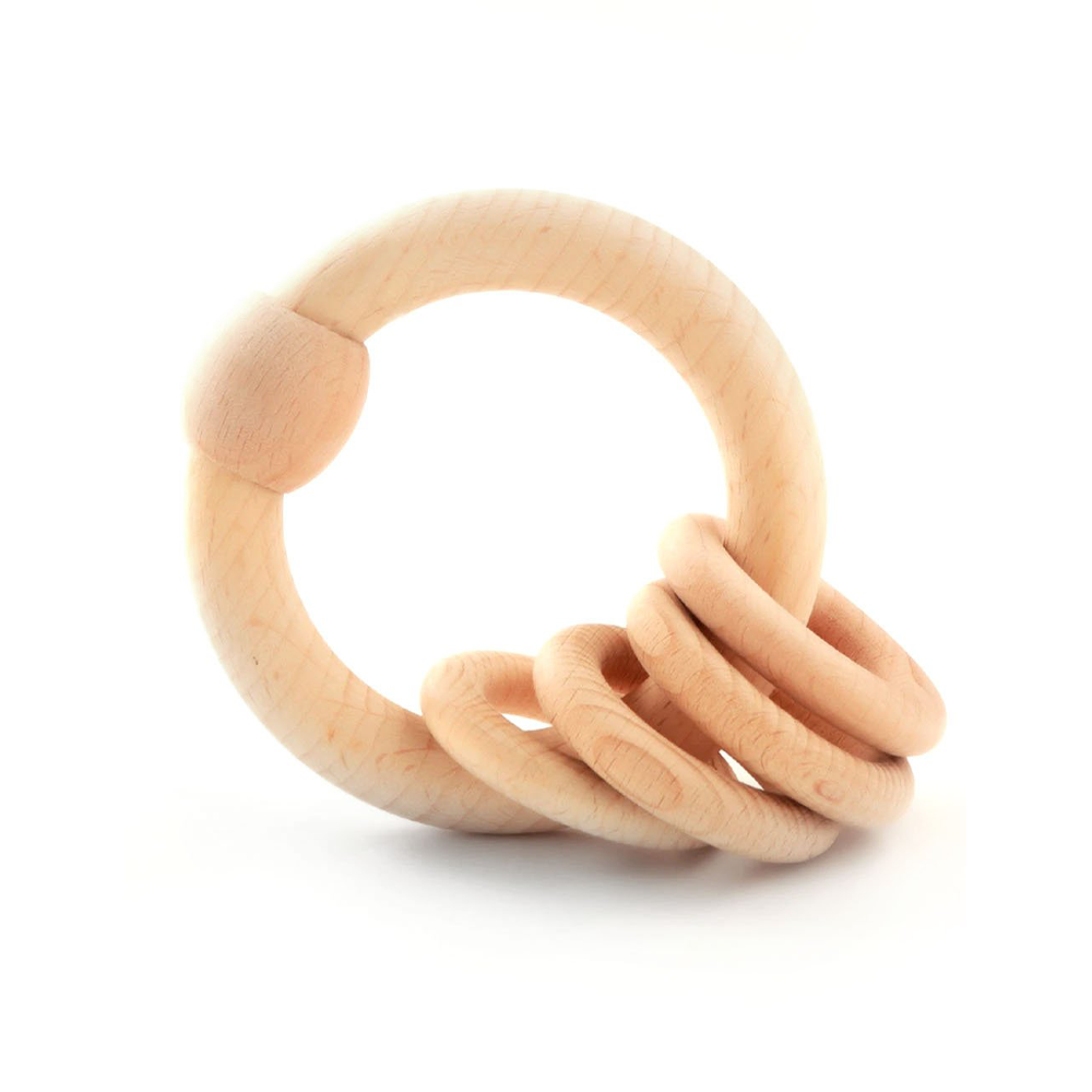 handcrafted wooden rattle is a safe, sensory-rich toy designed for curious little hands.




