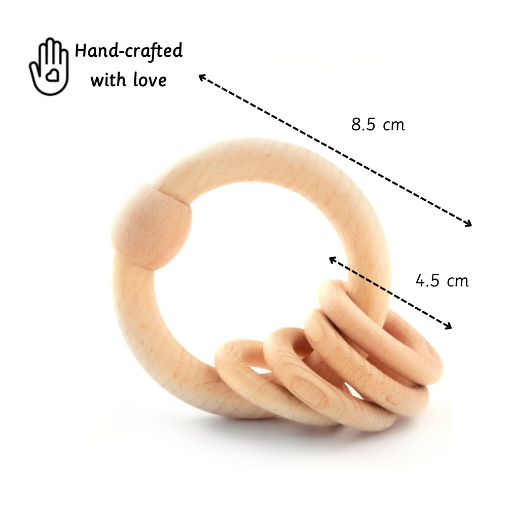wooden rattle offers a perfect grip for little hands to explore safely and naturally.