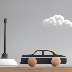 wooden taxi, painted in classic black and yellow with smooth rolling wheels, offers a safe and stylish ride for little hands 