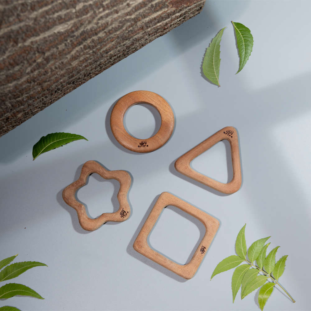  wooden baby teethers in circle, star, triangle, and square shapes made up of neem for infants




