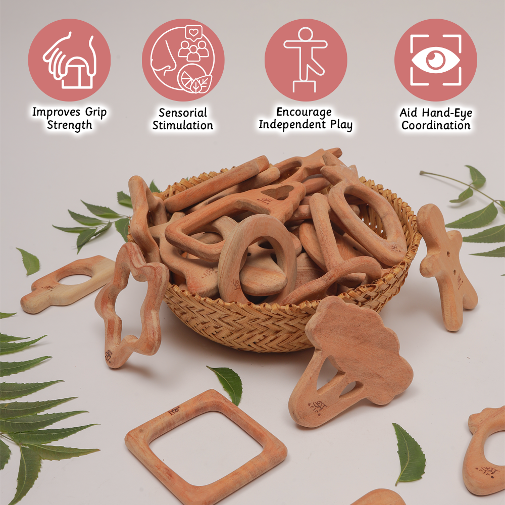 A basket of handcrafted wooden teethers in playful shapes is shown with icons highlighting benefits like improving grip strength, sensory stimulation, independent play, and hand-eye coordination.