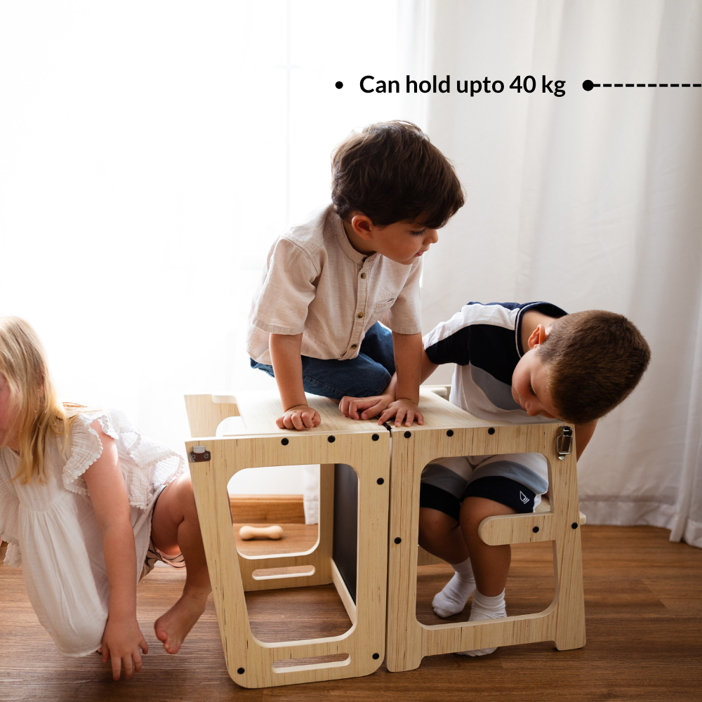 Children sitting and climbing on Ariro wooden learning tower showing strong design supporting up to 40 kg weight