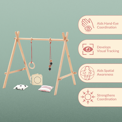 Ariro Montessori wooden baby floor gym with hanging toys designed to develop hand-eye coordination, visual tracking and spatial awareness for newborns and infants.
