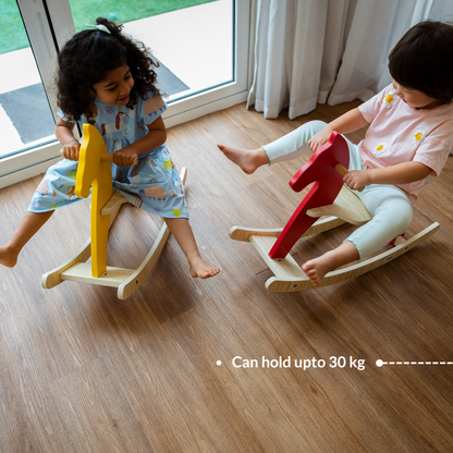 Children playing on wooden rocking horse toy with weight capacity up to 30 kg.
