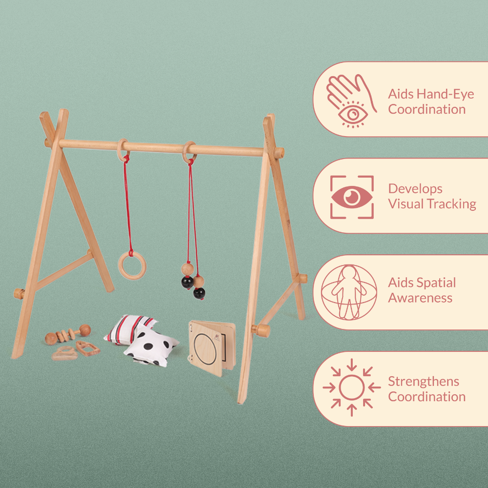 Ariro wooden Montessori baby floor gym with hanging toys designed to develop hand-eye coordination, visual tracking, spatial awareness and early motor skills in infants