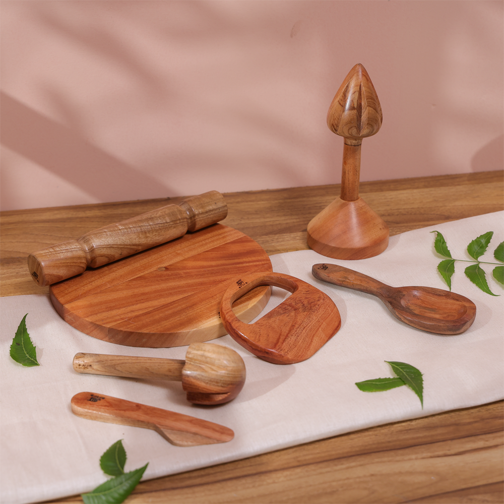 Little Chef’s Neem Kitchen Set with wooden rolling pin, cutting board, lemon squeezer, churner, rice ladle, butter knife and child-safe knife for Montessori practical life activities