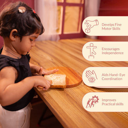 Child using butter knife from Little Chef’s Neem Kitchen Set to spread butter on bread, demonstrating Montessori practical life activity that develops fine motor skills and hand-eye coordination