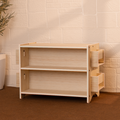 Montessori toy and book shelf in natural wood with open shelves and side book racks