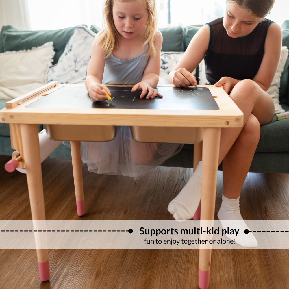 Children drawing together on a wooden Montessori sensory activity table with chalkboard surface designed for collaborative play and creative learning.