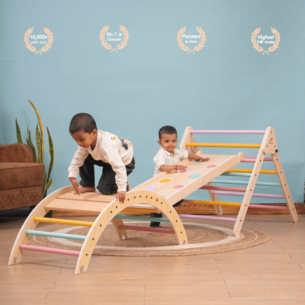 Pikler Triangle – wooden climbing and sliding playset for toddlers engaged in climbing and balancing activity indoors.