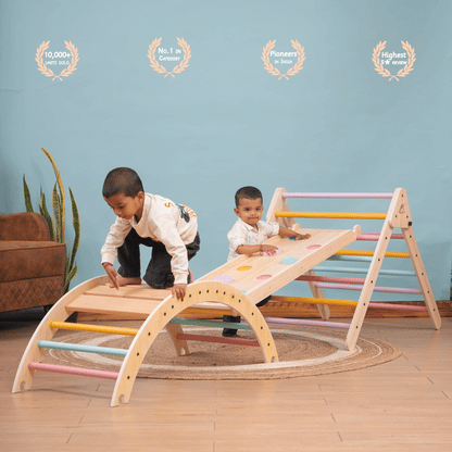 Pikler Triangle – wooden climbing and sliding playset for toddlers engaged in climbing and balancing activity indoors.