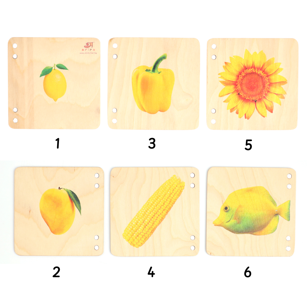 wooden puzzle tiles, each depicting a different yellow-colored object, such as a lemon, a sunflower, and a fish.